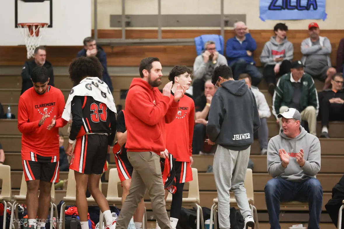 Coach Dunny working with players from the sideline